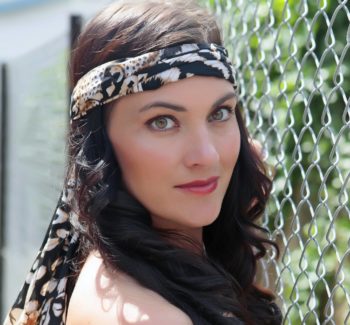brunette girl with scarf wrapped around her head