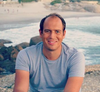 guy headshot with beach in the background