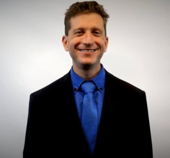Seth Greene blue tie headshot