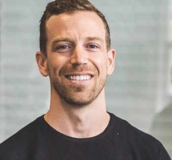 blonde guy smiling headshot
