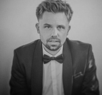 blonde guy in a suit