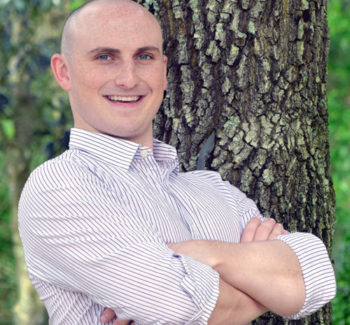 guy smiling tree background