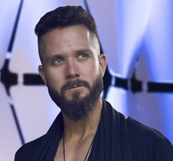 bearded man wearing black shirt