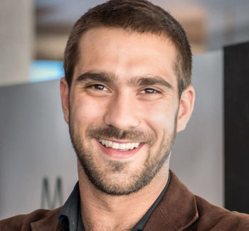 headshot of a man smiling
