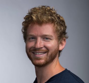 headshot of a man smiling
