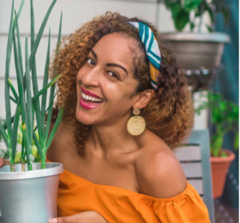 woman holding a plant