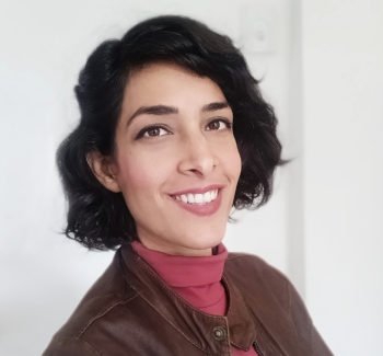 headshot of a woman wearing leather jacket