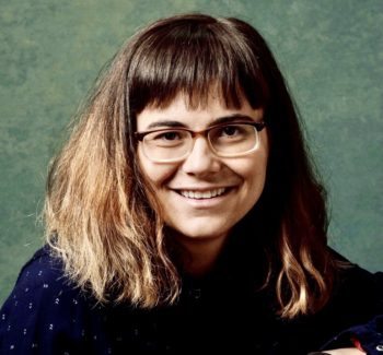 headshot of a woman wearing glasses