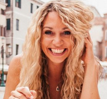 headshot photo of a blonde woman smiling