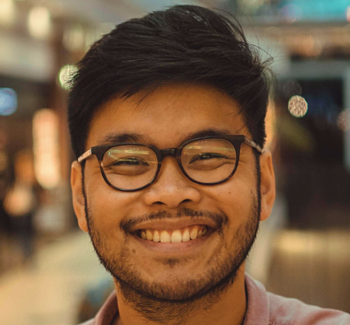headshot photo of a man smiling