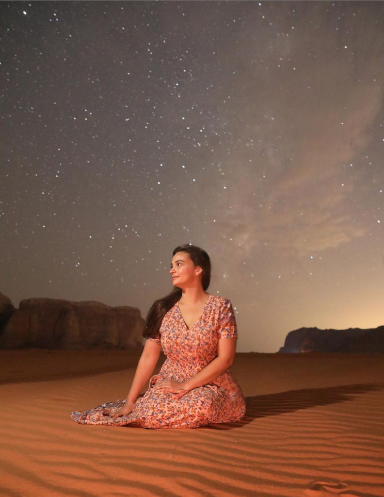 photo of a woman in the midnight desert