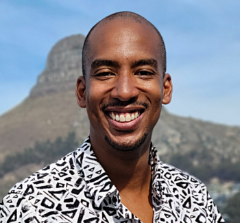 headshot photo of a man smiling
