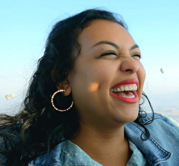 lady smiling wearing blue jacket