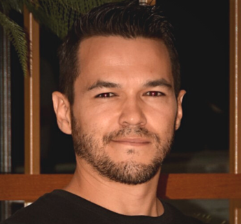 man smiling posing for a picture