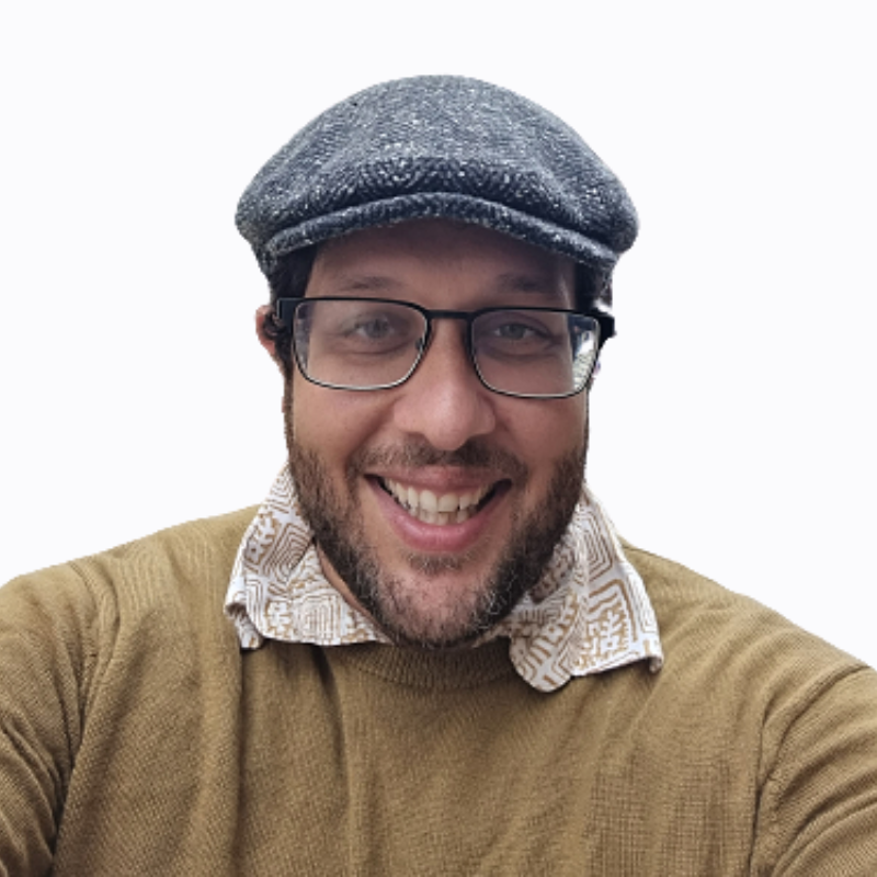 headshot of a man wearing glasses
