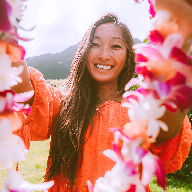 Danielle Hu holding a lei