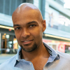 headshot photo of a man smiling
