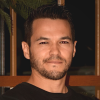 man smiling posing for a picture