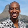 headshot photo of a man smiling
